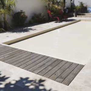 Swimming pool cover with submerged slats