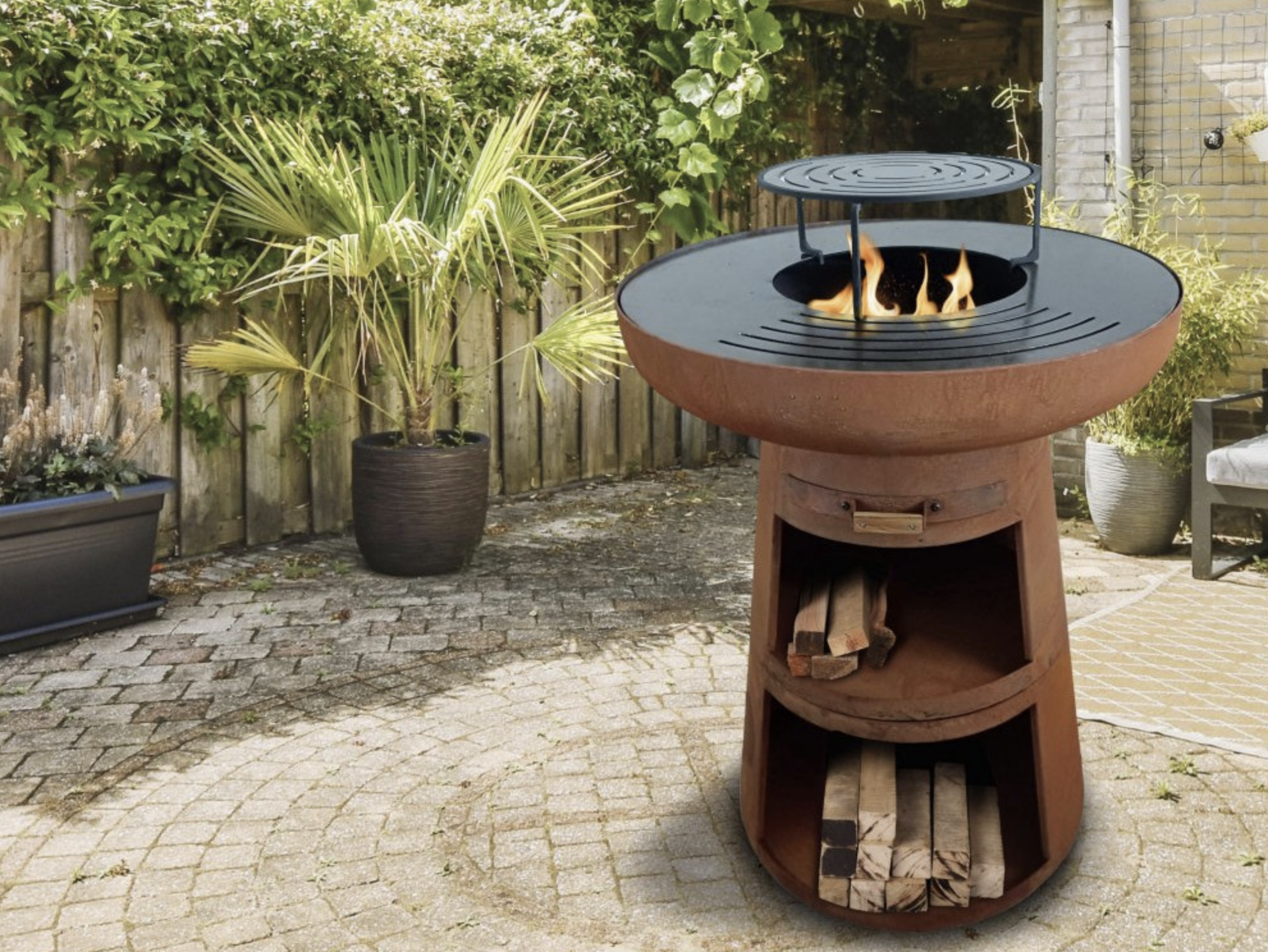 Round barbecue with Pure line steel plate Alu Floors Scandinavia